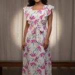 Floral Fiesta Maxi Dress with ruffle details and vibrant flower prints, ideal for summer events.