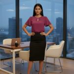 Chic purple keyhole formal blouse with black pencil skirt in an office setting