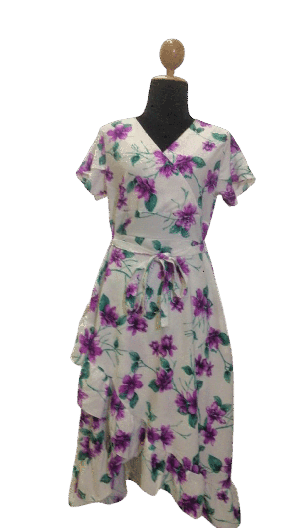 Floral midi dress with purple blooms, featuring a wrap design and ruffled hem, perfect for spring and summer.